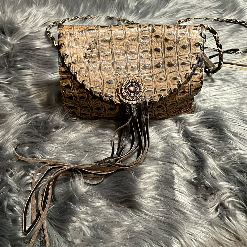 Handmade leathered crossbody.